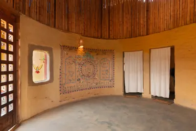 Traditional clay walls and natural cooling design of mud house wayanad villa boCHE 1000 acre resort wayanad