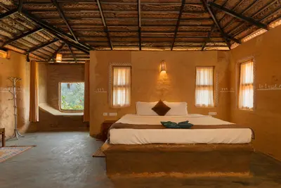 Unique earthen seating area inside the handcrafted mud house boche 1000 acre resort wayanad