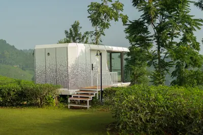 Hill Pod Futuristic xpod wayanad villa exterior with glass front at boCHE 1000 Acres resort in wayanad