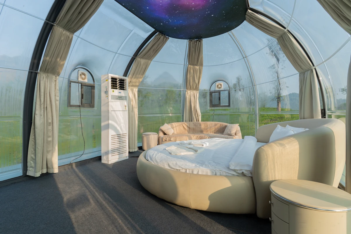 Elegantly decorated dome room with panoramic window views, perfect for wayanad resort booking